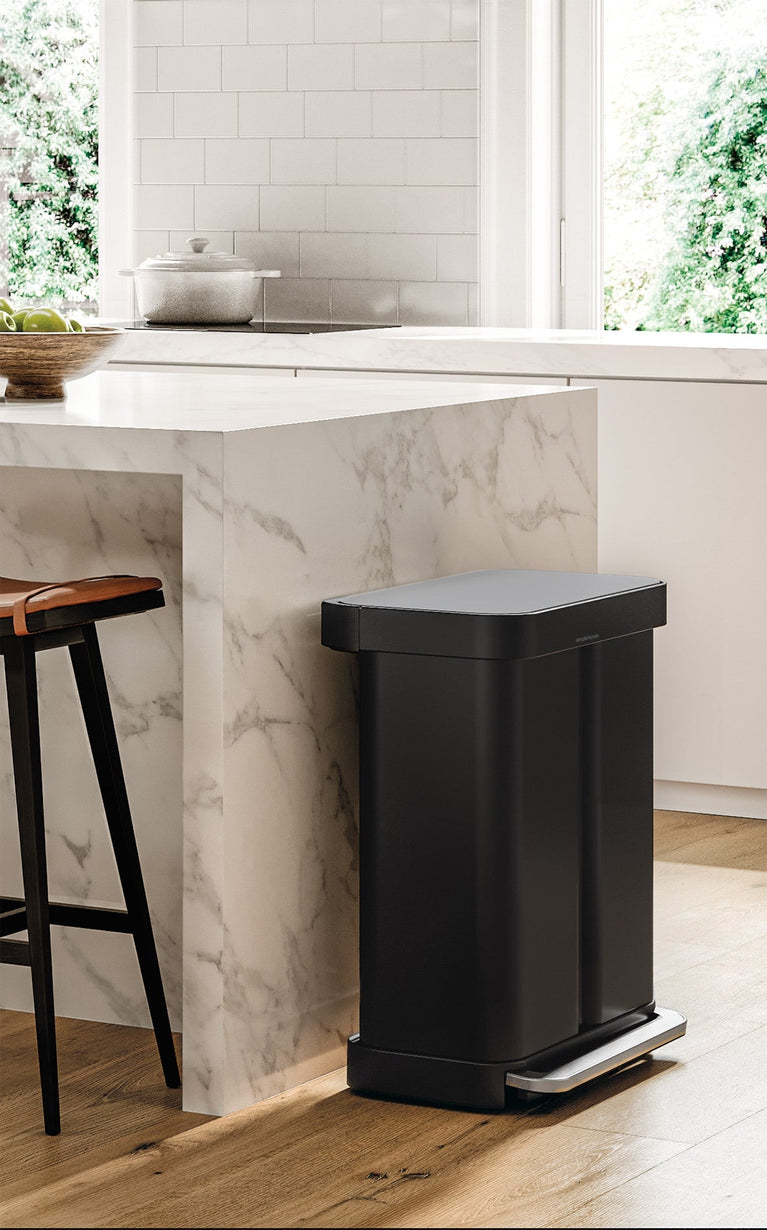 Simplehuman's Matte Black Step Recycler in a modern kitchen setting