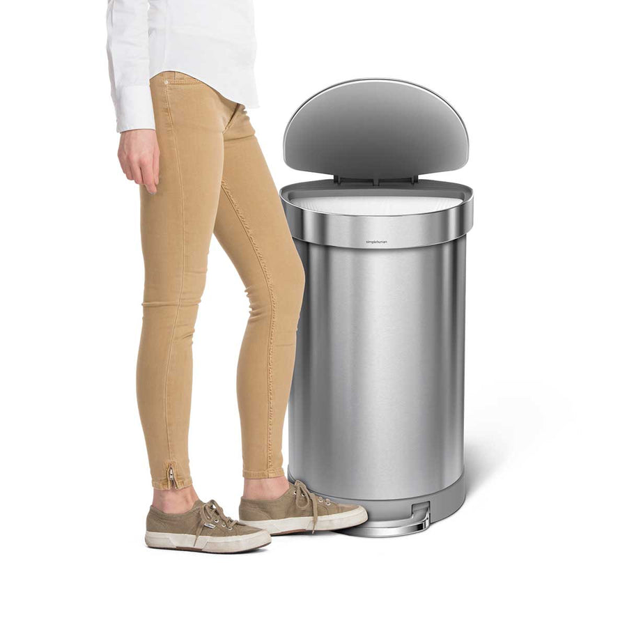 45L semi-round pedal bin with liner rim - brushed finish - lifestyle foot stepping on pedal image