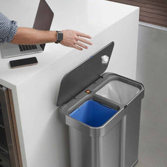 58L dual compartment rectangular sensor bin with voice and motion control - brushed stainless steel - lifestyle dual compartments throwing rubbish away